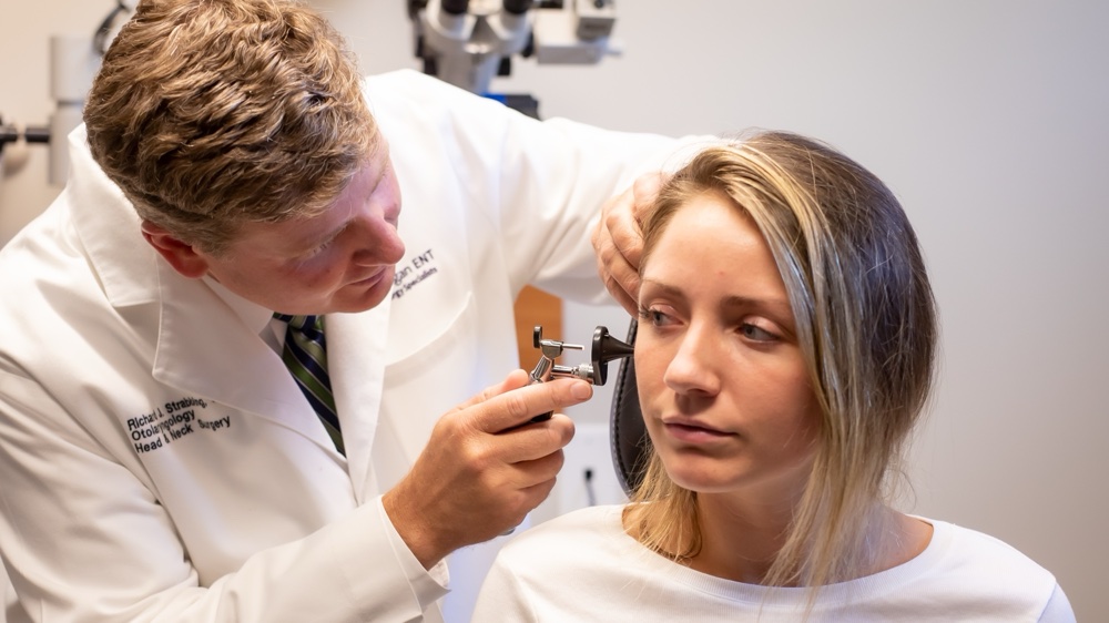 An ENT Physician Examines a Patient's Ear at a Parallel ENT & Allergy Practice