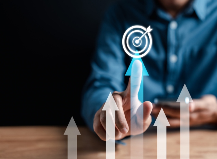 businessman pointing to arrow showing value increase